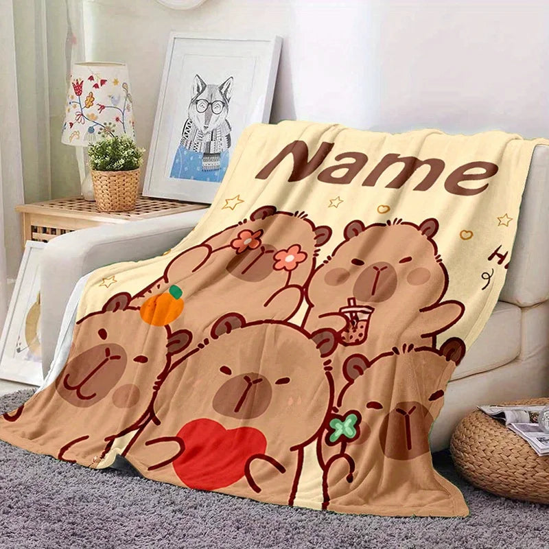 A tan flannel blanket featuring cute bear illustrations and the word Name.