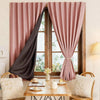 Pink sheer curtains framing a window with greenery and a wooden table and light fabric accents