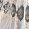 White and blue gauze curtain with gold embroidery featuring ornate floral patterns