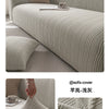 A light beige knitted sofa slipcover shown on a modern sofa, featuring a textured diamond pattern.