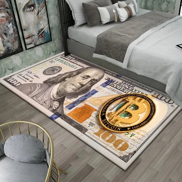 A rectangular area rug featuring a detailed print of a hundred dollar bill and Bitcoin on a gray floor.