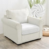 A cream-colored upholstered armchair with vertical stripes and a white cushion sits on a light wood floor.