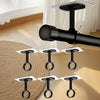 A close-up view of black no-drill adhesive curtain hooks mounted on a white wall.