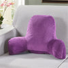 A purple plush lumbar support cushion with arms resting on a light gray sofa.