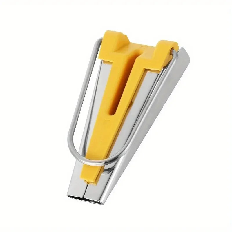 A silver bias tape maker set with a yellow awl tool for sewing and quilting.