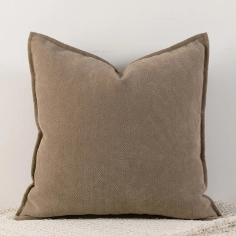 A solid taupe chenille throw pillow cover with a subtle texture.