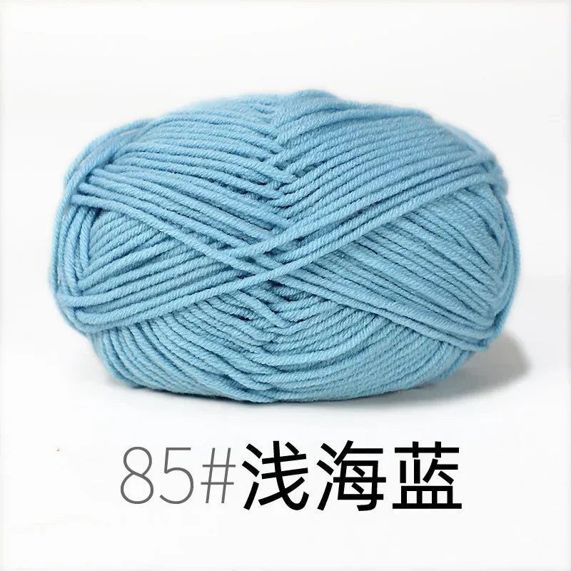 A ball of light blue organic cotton 4ply knitting yarn for crafts.