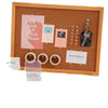 A wooden frame display featuring various inspirational cards and clear plastic push pins with steel tips.
