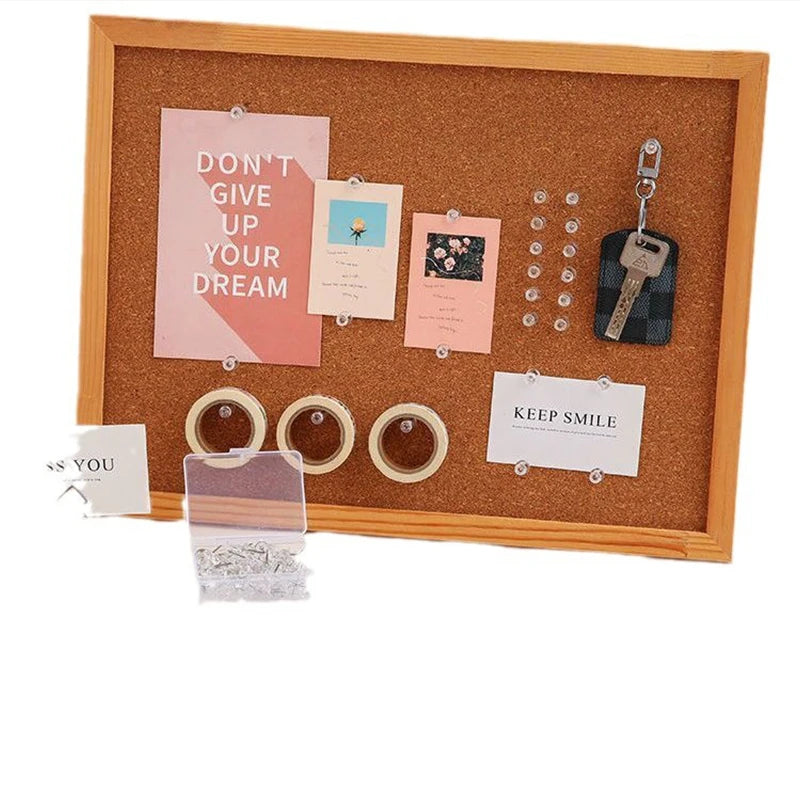 A wooden frame display featuring various inspirational cards and clear plastic push pins with steel tips.