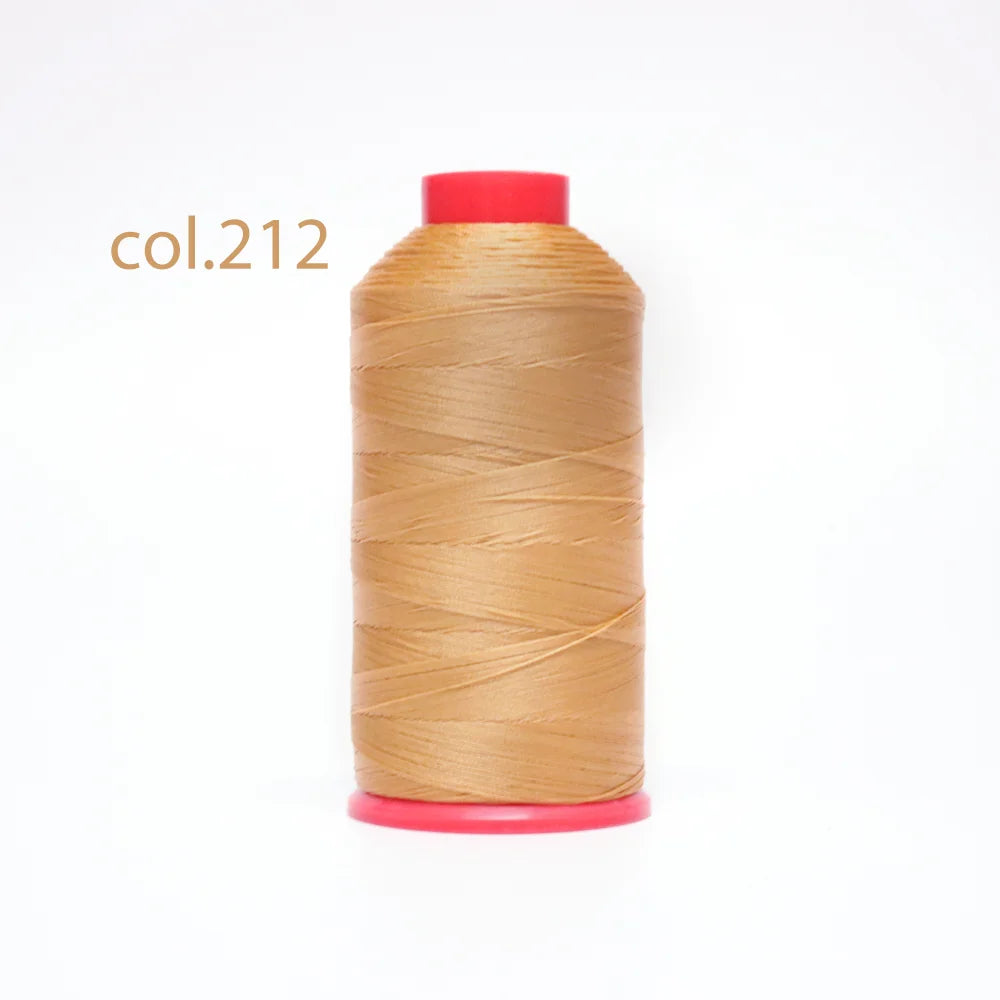 A spool of col.212 heavy duty nylon sewing thread with a red cap.