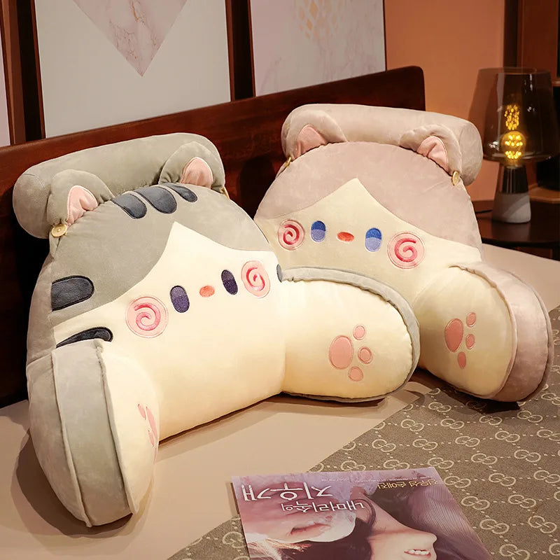 A light pink and gray cute animal plush sofa cushion resting on a table.