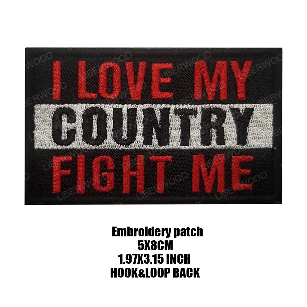 Black embroidered patch with red text that reads I LOVE MY COUNTRY FIGHT ME