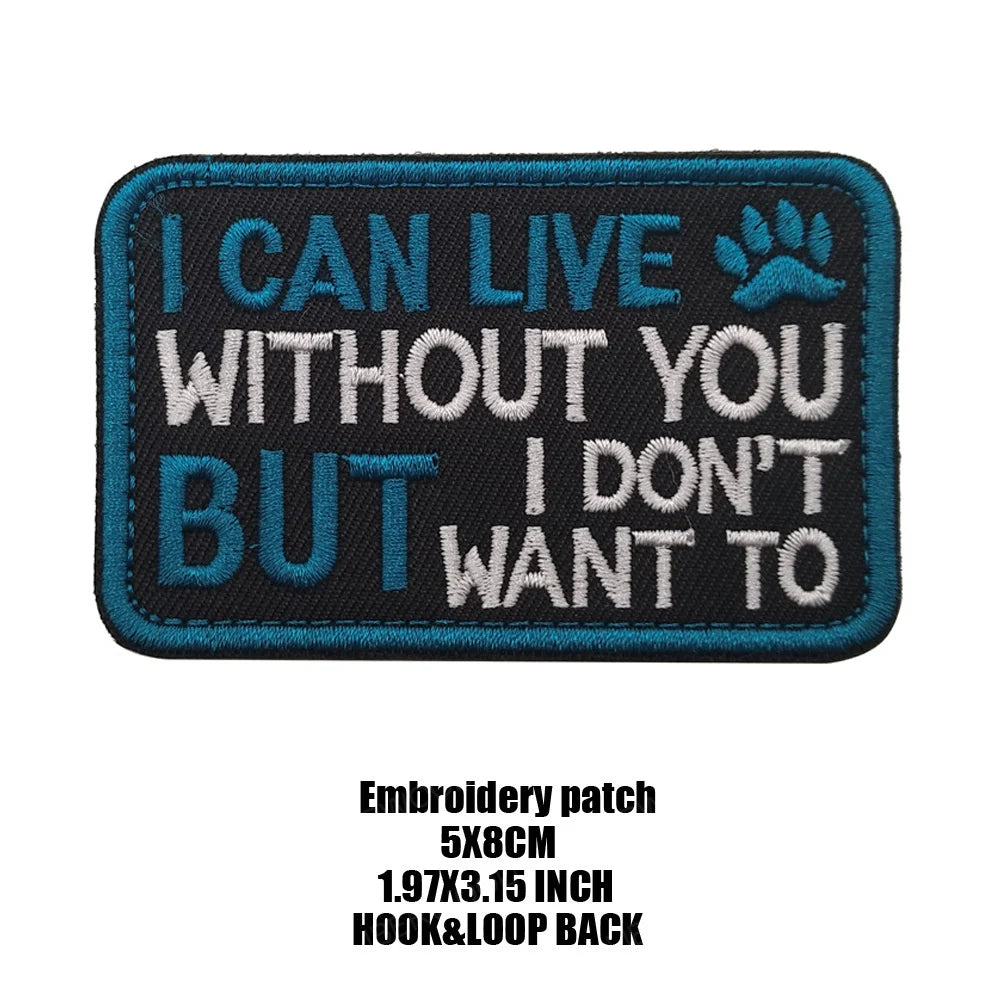 A dark blue embroidered patch with white text that reads I CAN LIVE WITHOUT YOU BUT I DON'T WANT TO