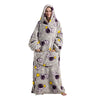 A woman wearing a gray sherpa fleece oversized blanket hoodie with a purple and yellow animal print.