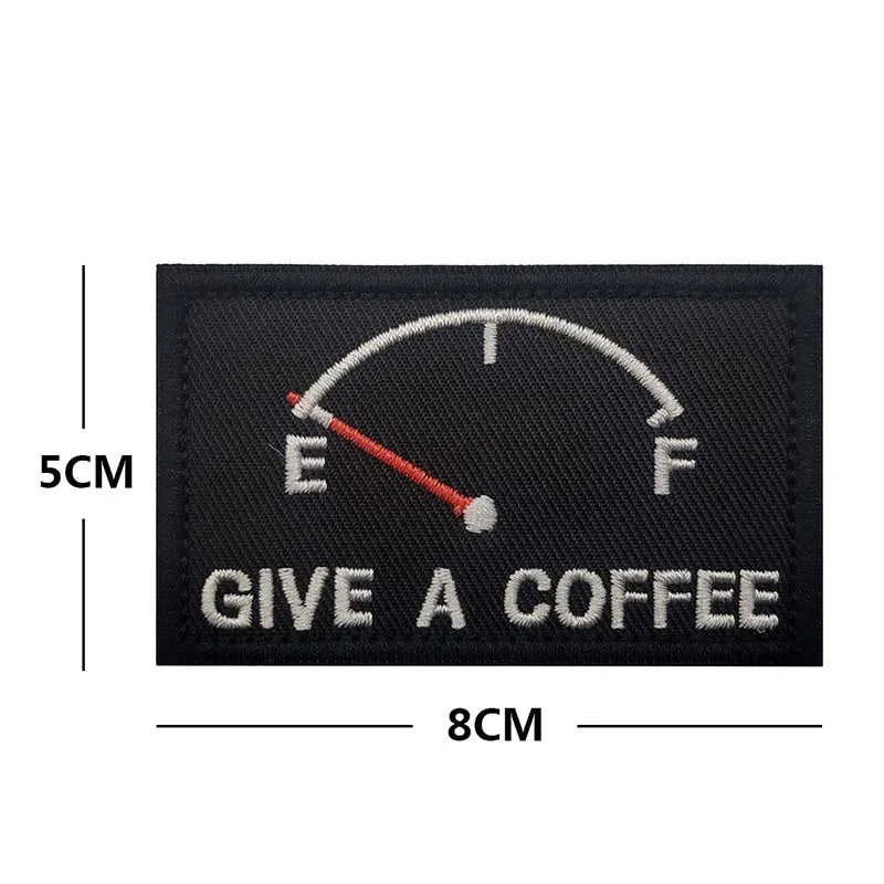 Black embroidered patch with a coffee-themed gauge showing 'Give a Coffee' text
