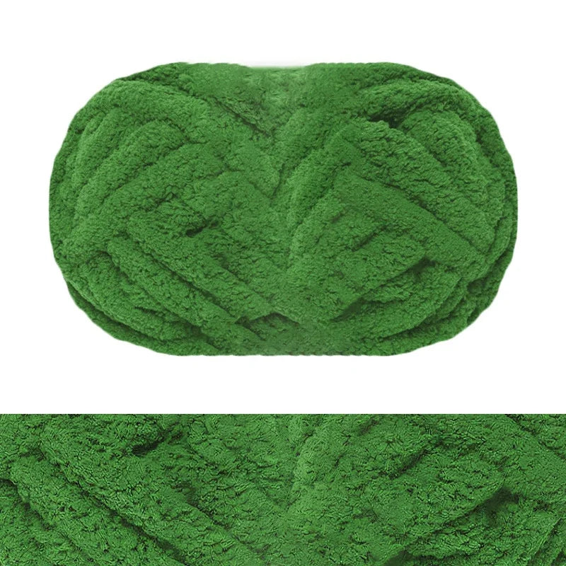 A close-up view of a hand-knitted wool finger line scarf in a textured, mossy green color.
