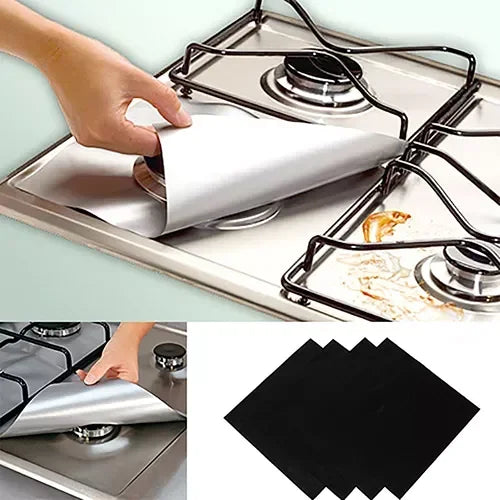 A hand is placing a reusable gas hob protector liner onto a stovetop grate.