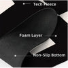 Close-up view of a black non-slip dish drying mat showing layers including tech fleece, foam, and a non-slip bottom.