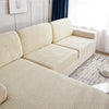 A cream-colored sofa cushion cover featuring a textured, quilted pattern in a light beige tone.