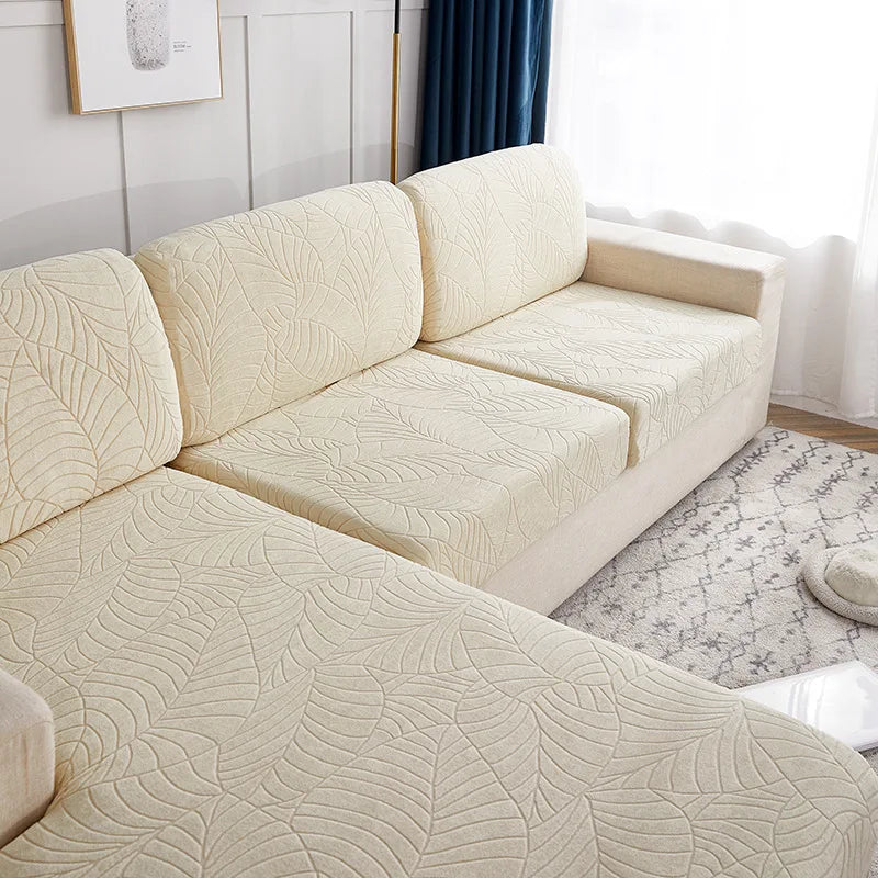 A cream-colored sofa cushion cover featuring a textured, quilted pattern in a light beige tone.