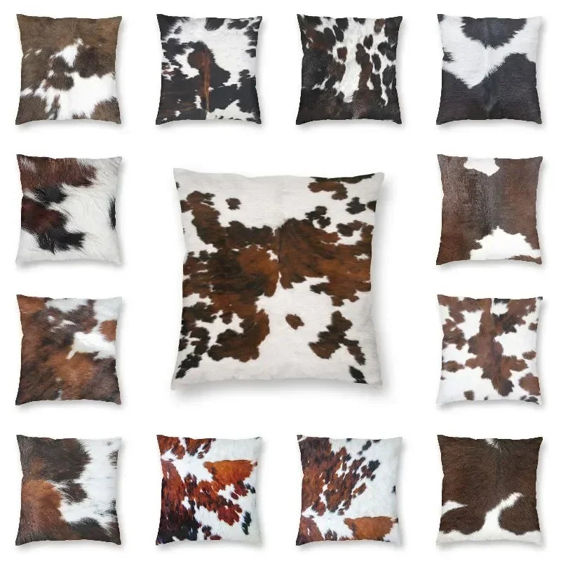 A collection of faux fur cowhide print cushion covers in various brown and white patterns.