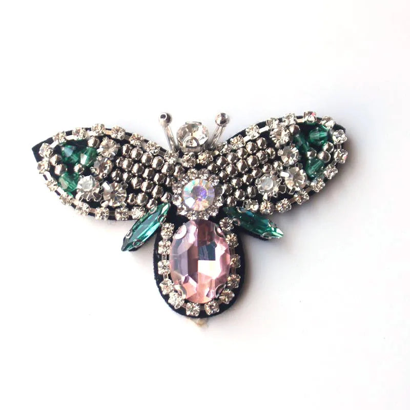 Handmade bee beaded sew-on patch featuring iridescent pink and green sequins and rhinestones