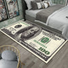 A rectangular anti-slip area rug featuring a design of a hundred dollar bill on a light background.