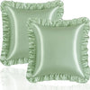 A set of two ruffled satin pillowcases in a sage green color.