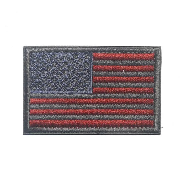 A rectangular patch depicting the design of the United States flag with a hook and loop backing.