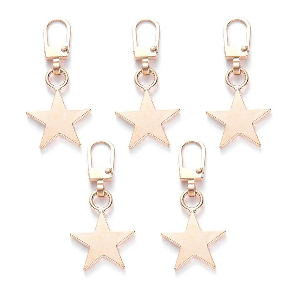 A set of five gold-toned metal zipper pull replacement earrings with hook closures.