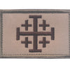 A rectangular embroidered military cross shield patch in tan fabric with a dark brown cross design.