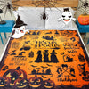 Orange flannel blanket featuring a Halloween design with witches, bats, pumpkins, and spooky silhouettes.