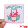 Pink embroidered patch featuring a golf cart illustration surrounded by green leaves and a pink border