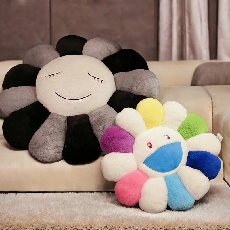 A fluffy sunflower plush cushion with a smiling face resting on a beige sofa.