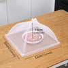 A clear mesh insect and fly protection cover is shown resting on a wooden table.