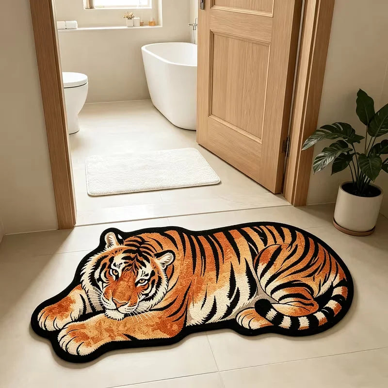 An orange and black tiger plush cartoon area rug lying on a light tiled floor.
