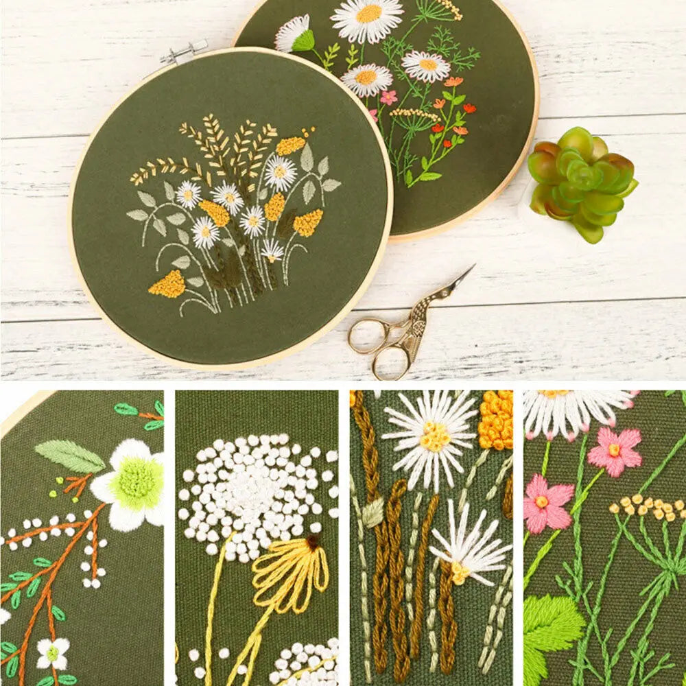 A floral cross stitch embroidery kit featuring various fabric patterns and a pair of scissors on a light wooden surface.