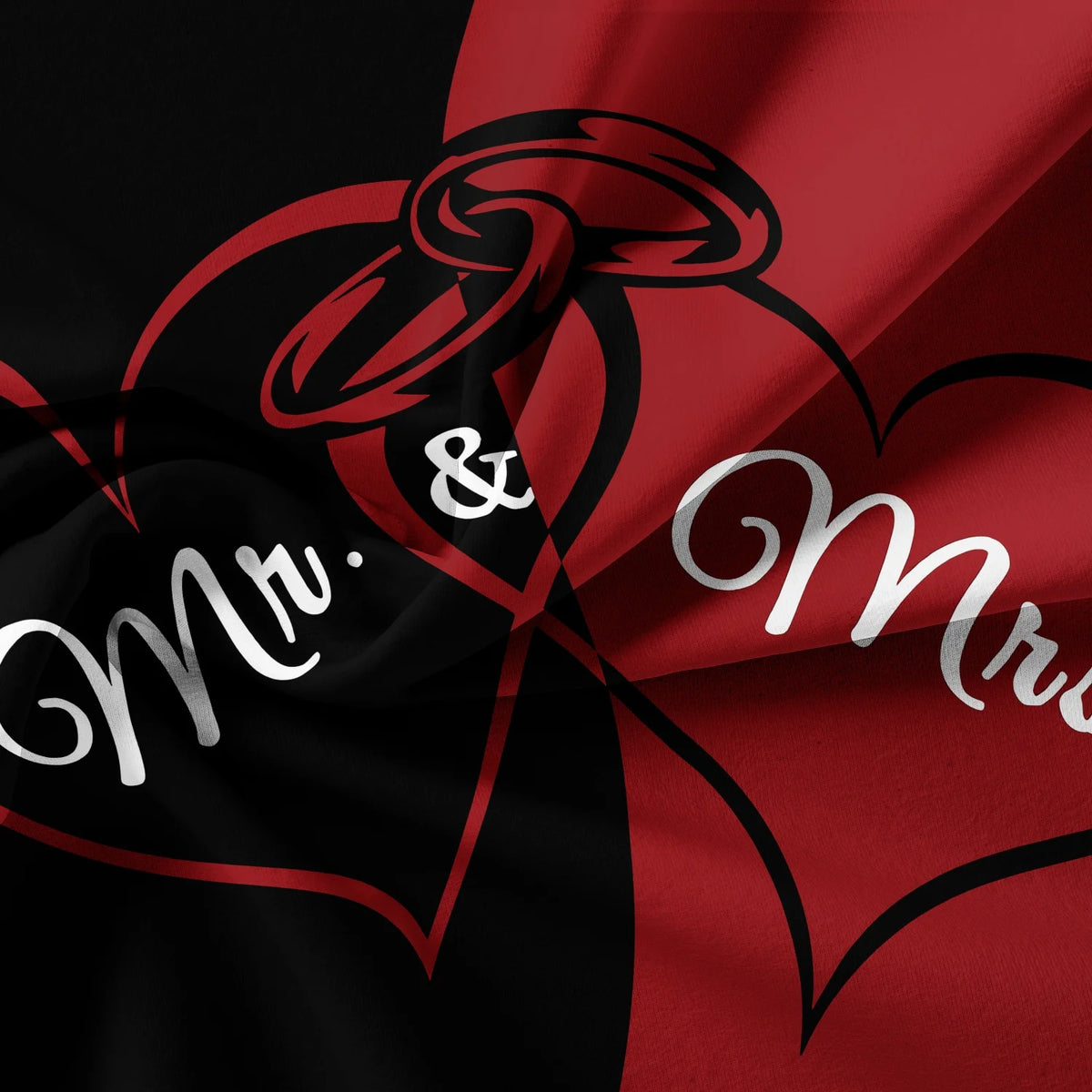 A fabric design featuring a black heart outline with a red ribbon and silver script reading Mr & Mrs.
