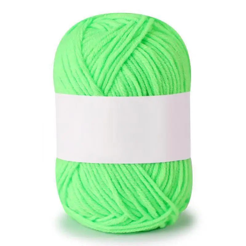 A ball of bright lime green soft milk cotton knitting yarn.