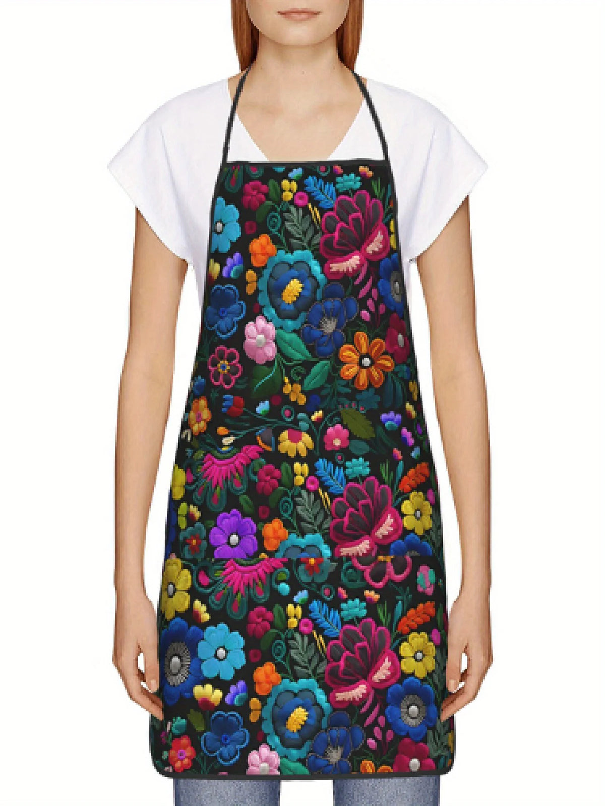 A woman wearing a floral tatting apron over a white shirt.