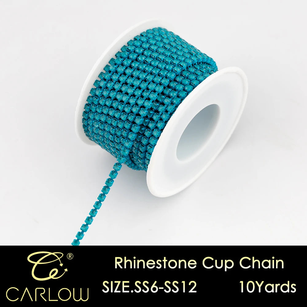 A spool of turquoise glass rhinestones used to create a cup chain for DIY decoration.