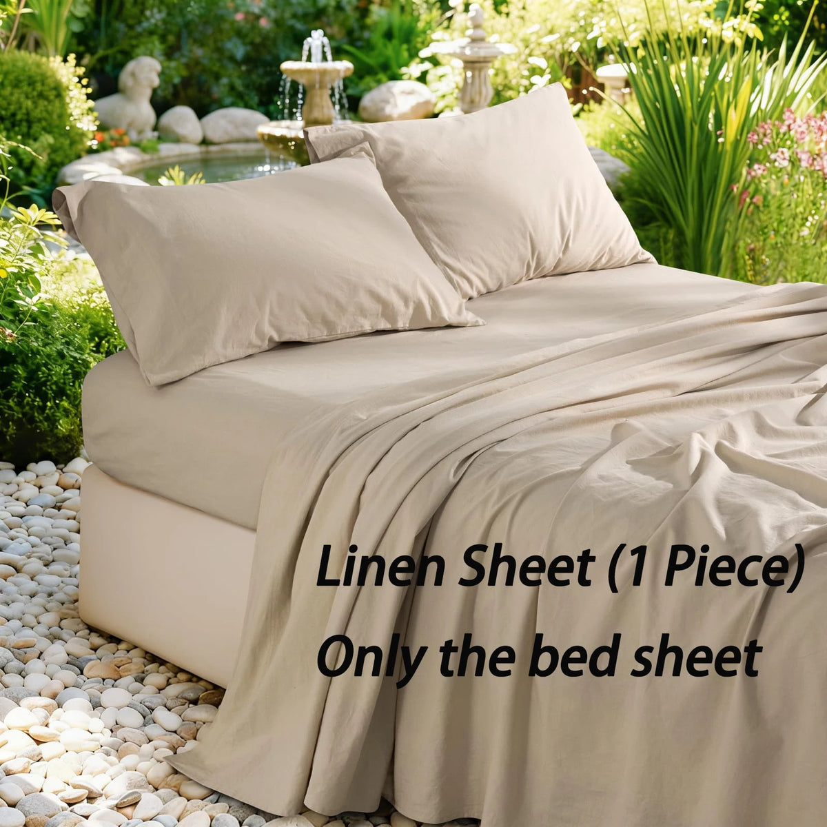 A beige linen bed sheet is draped over a bed, surrounded by greenery and decorative stones.
