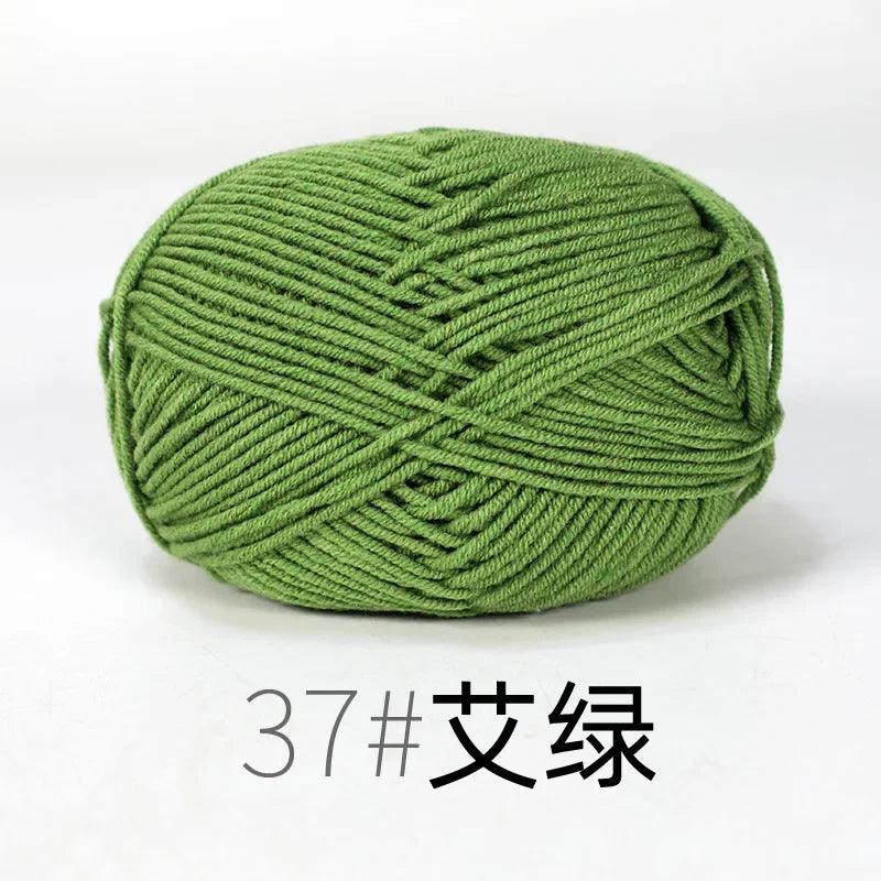 A ball of olive green organic cotton 4ply knitting yarn.