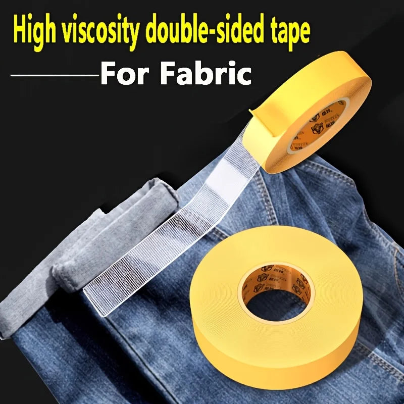Yellow high viscosity double-sided fabric tape rolled on a denim shirt.