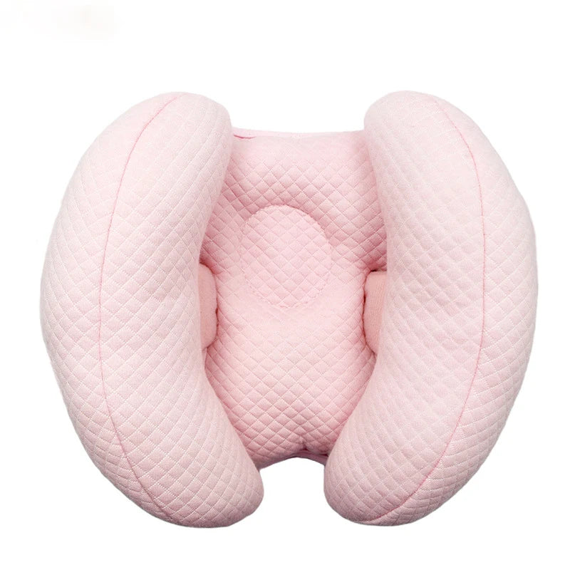 Pink quilted baby head and neck support pillow for stroller and car seat