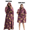 A purple adult long fleece blanket hoodie with gold embroidered elephants shown on a model.