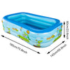 Blue inflatable pool shaped like a boat with tropical designs for backyard fun