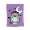 A purple throw blanket featuring a cute cat plush design with a crescent moon and stars.