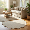 A natural jute non-slip entrance door mat placed on a wooden floor in a bright living room setting.