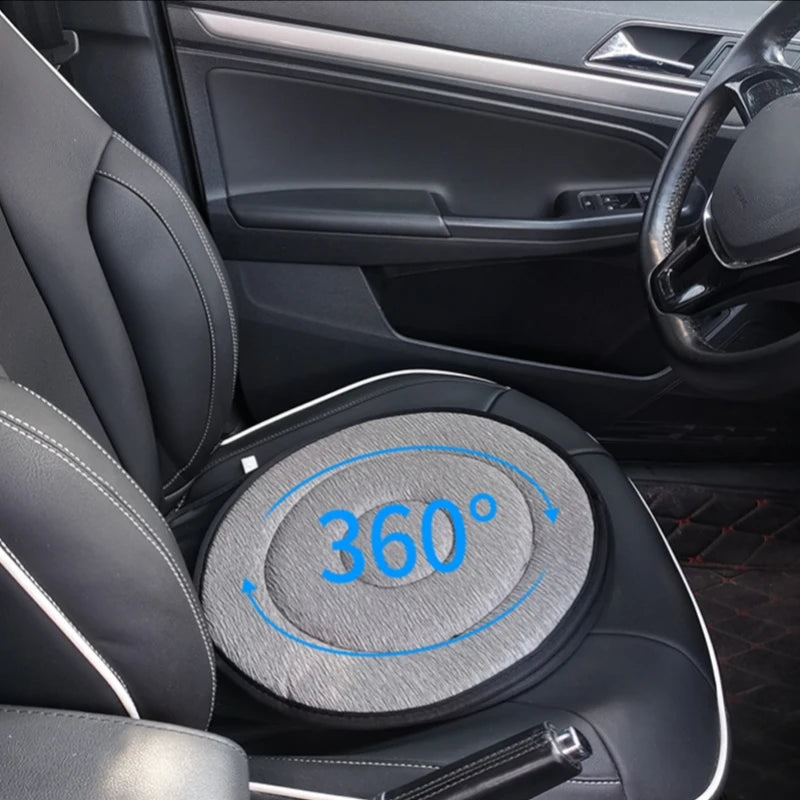 A close-up view of a black car seat cushion with a 360 degree rotating feature.